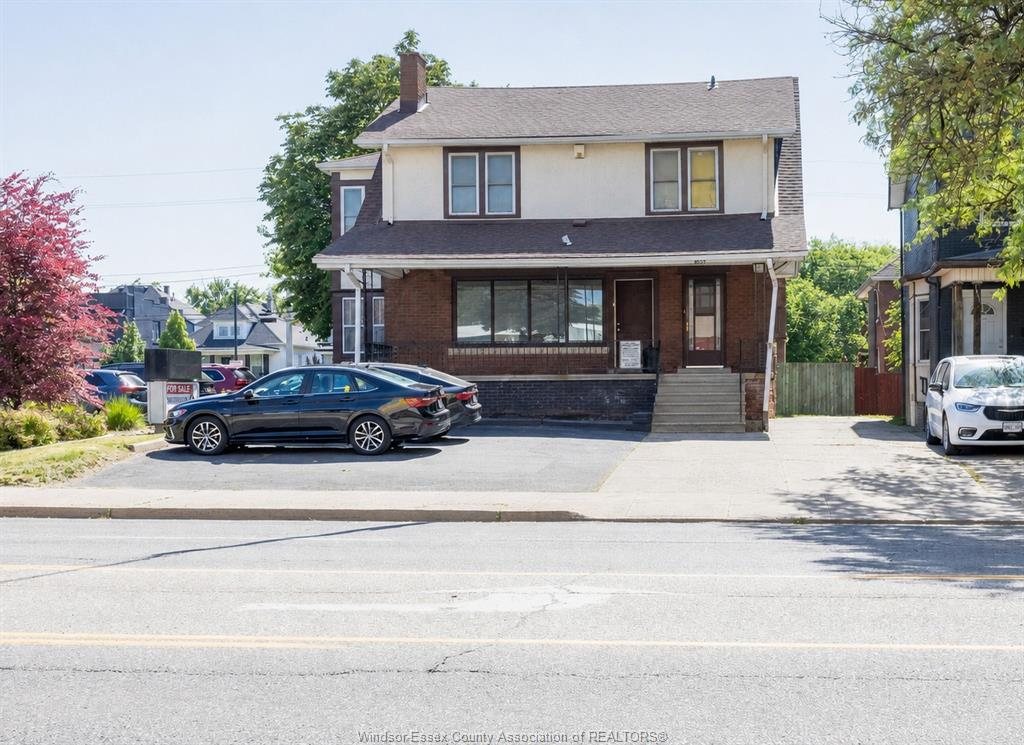 Front of 1069 Ouellette Avenue with paved on-site parking