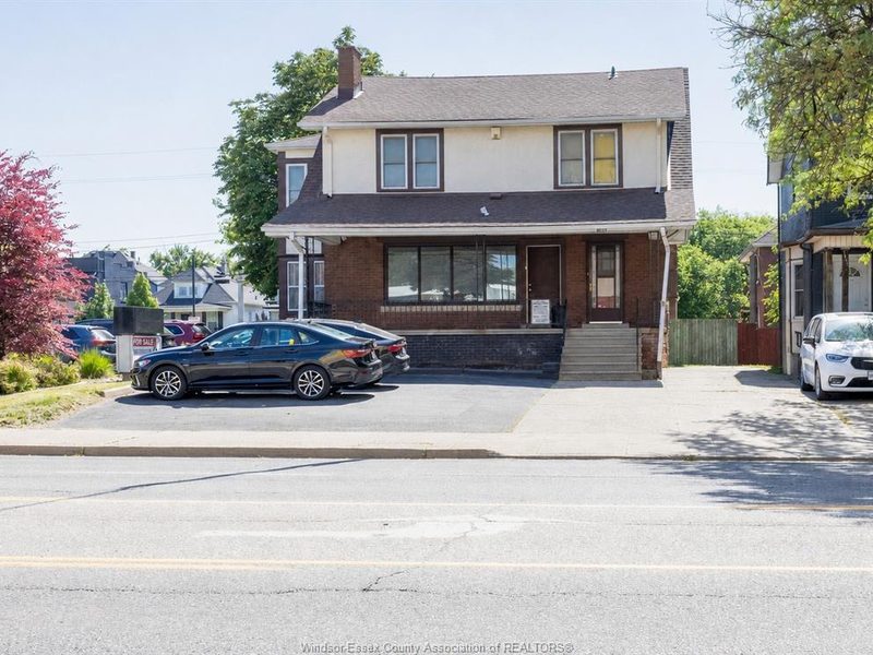 Front of 1069 Ouellette Avenue with paved on-site parking
