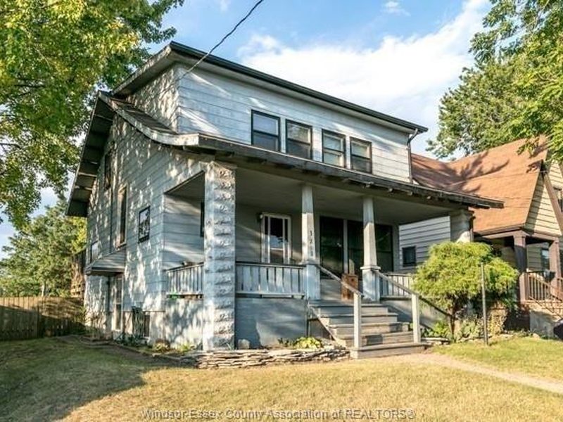 Detached home with a covered front porch at 328 John B Avenue